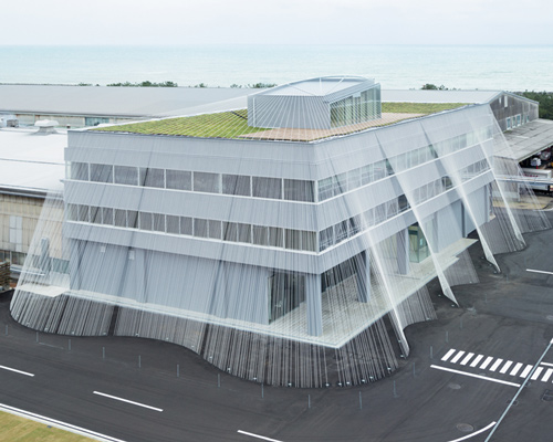 kengo kuma protects japanese office building with carbon fiber curtain