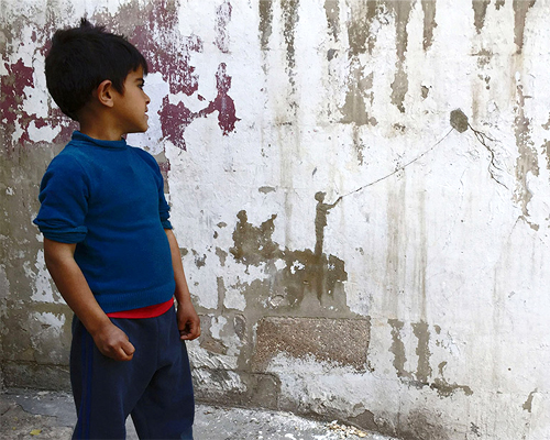pejac peels paint off palestinian walls to compose evocative landscapes