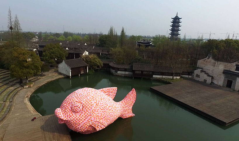 florentijn hofman forms floating fish from foam kick boards in wuzhen, china