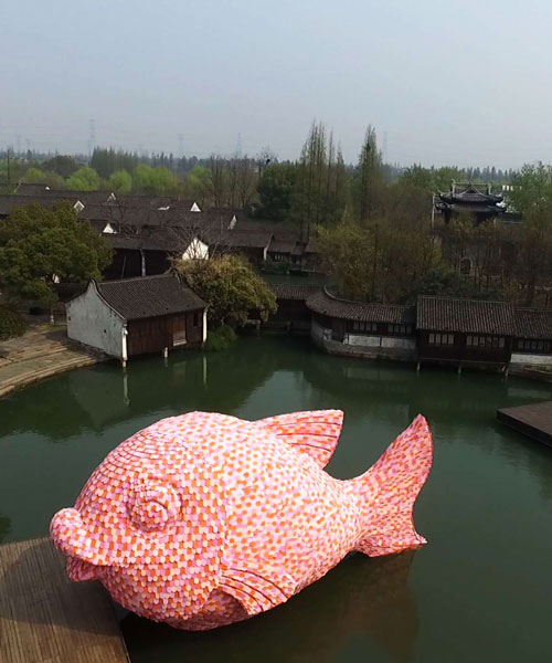 florentijn hofman forms floating fish from foam kick boards in wuzhen, china