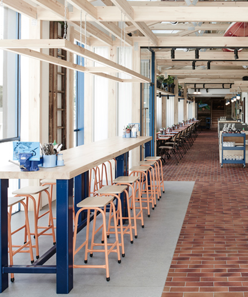 exposed timber frame highlights interior of techné's souvlaki restaurant