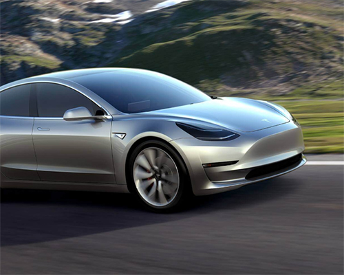 elon musk debuts tesla's model 3 with a range of 346 km on a single charge