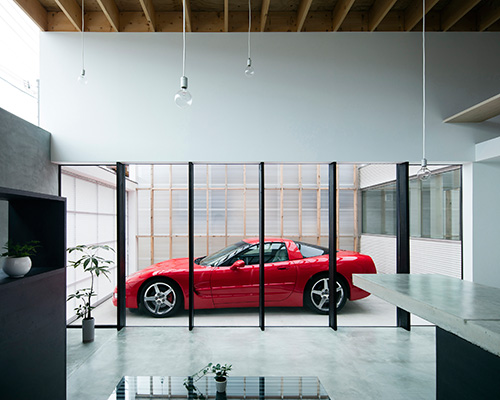 yoshiaki yamashita places transparent garage at the center of a kyoto home