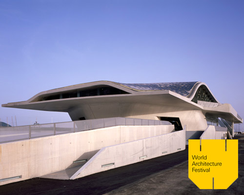 zaha hadid architects' ferry terminal in italy topped with asymmetric shell