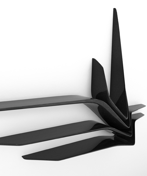zaha hadid sculpts valle shelves from black granite for CITCO