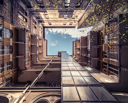 zsolt hlinka turns budapest's 100-year-old houses into tunnels to the sky
