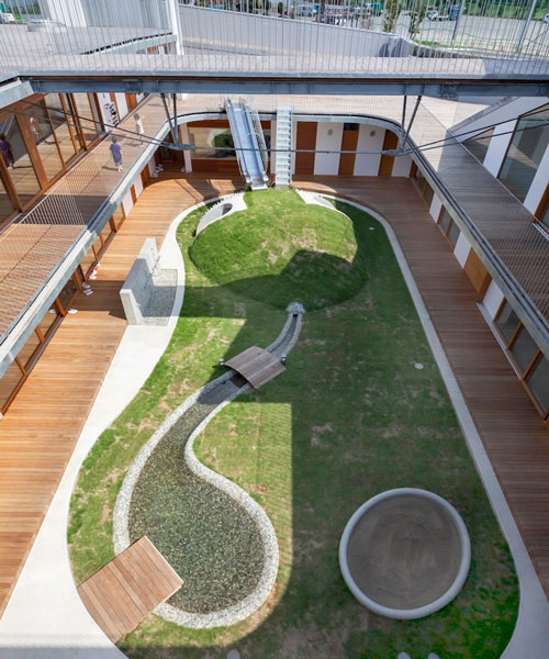 aisaka architects’ atelier organizes japanese nursery around grassy playground
