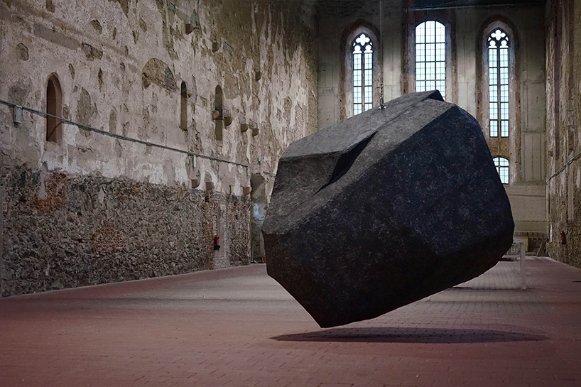 BORGMAN | LENK suspends behemoth 'boulder' within a monastery near leipzig