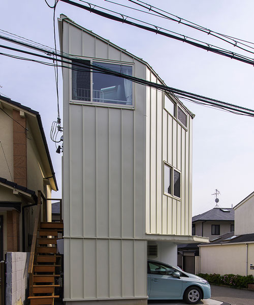 angular residence by coo planning sits on a corner plot in hyōgo, japan