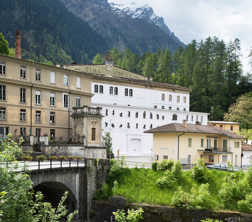 daniel gonzález wraps a chocolate factory in the swiss alps with paper