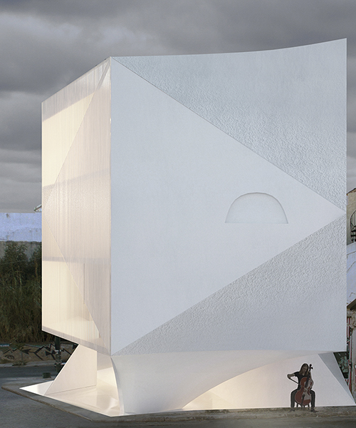 H50 apartment block by 314 architecture studio exposes raw marble through triangular curved faces