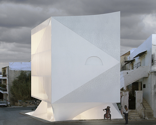 H50 apartment block by 314 architecture studio exposes raw marble through triangular curved faces