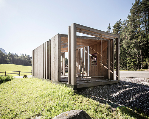 noa* builds swinging frames installation from wooden posts