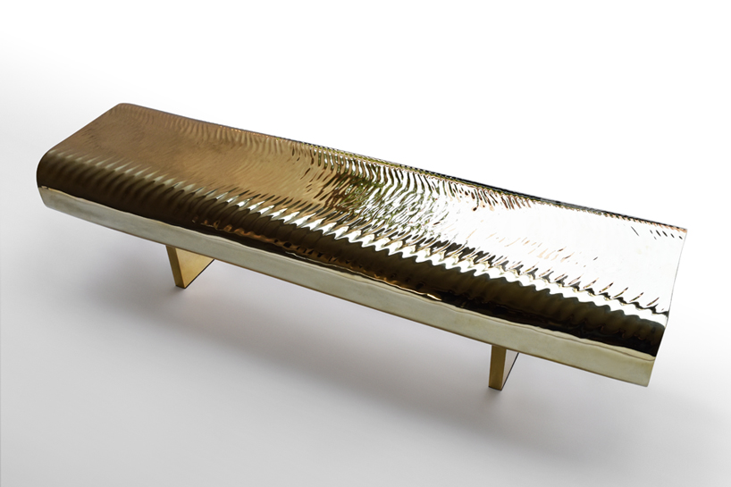 tokujin yoshioka metalizes water block bench in golden brass
