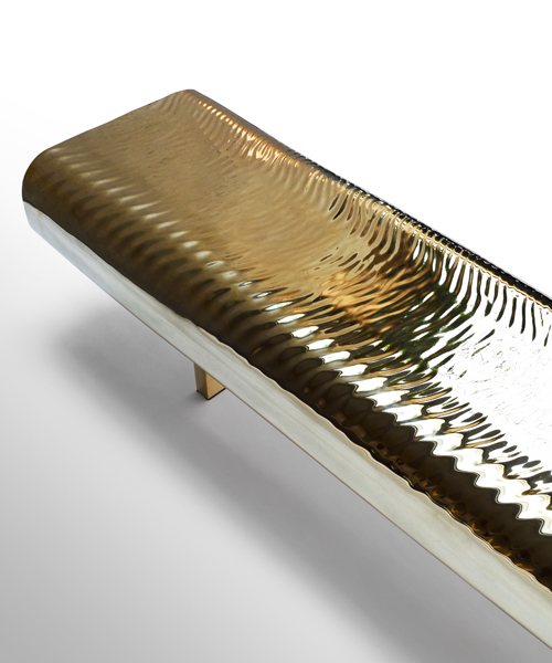 tokujin yoshioka metalizes water block bench in golden brass