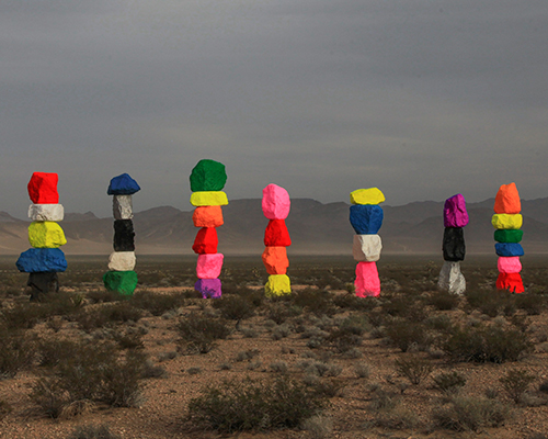 ugo rondinone erects seven magic mountains in the nevada desert