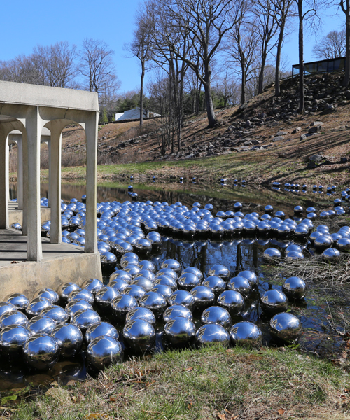 yayoi kusama floats a landscape of 1,300 mirrored spheres at the glass house