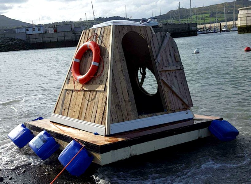 aodh design constructs small floating pod out of abadoned building materials