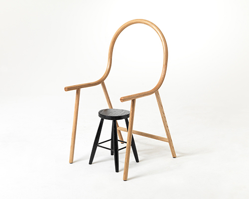 clark bardsley uses steam-bent oak to design an anti-chair