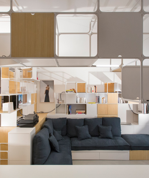 coudamy architectures wraps parisian apartment with multi-functional grid frame