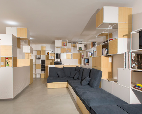 coudamy architectures wraps parisian apartment with multi-functional grid frame