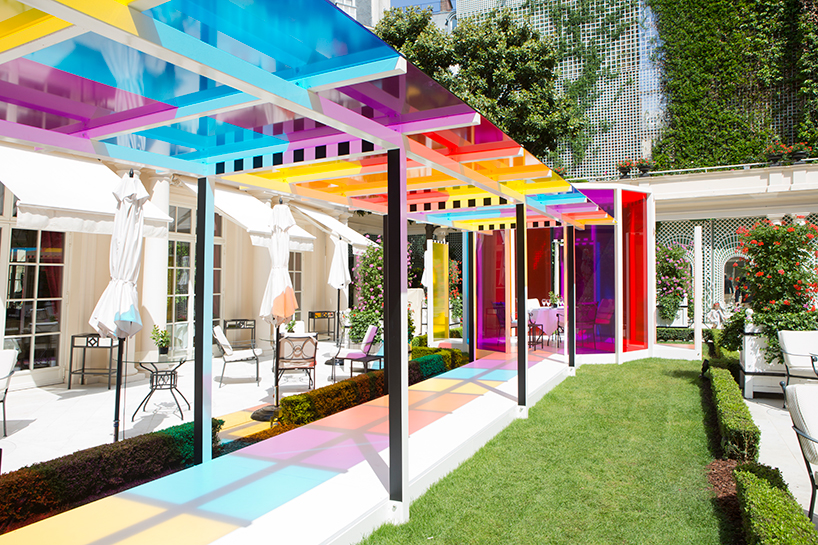 daniel buren creates a chromatic landscape in the gardens of hotel le bristol paris