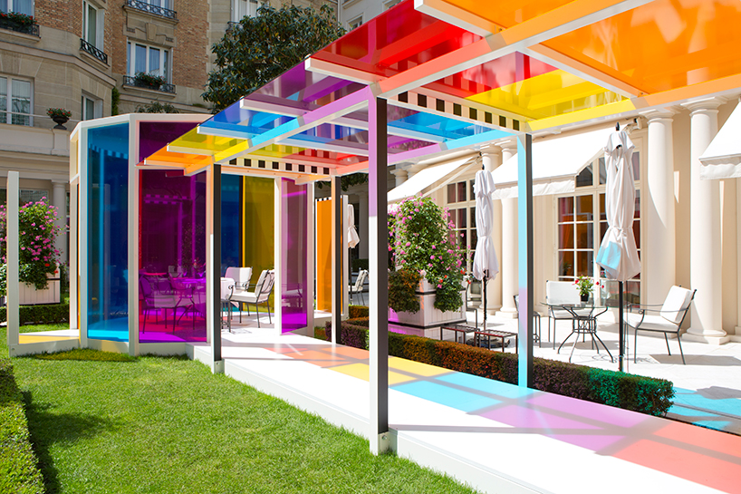 daniel buren creates a chromatic landscape in the gardens of hotel le ...