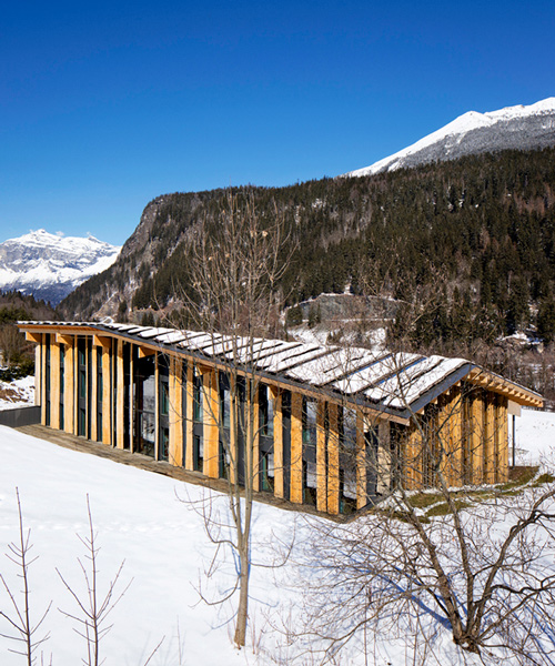 kengo kuma's timber office building sits by the base of mont-blanc