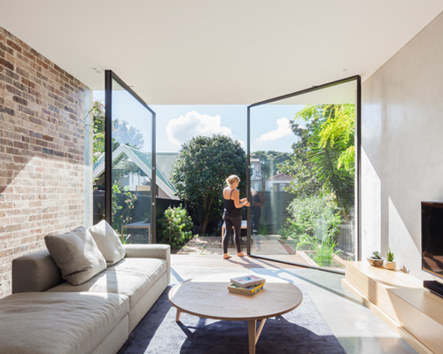 marston architects' D house blends inside and outside with fully pivoting glass door