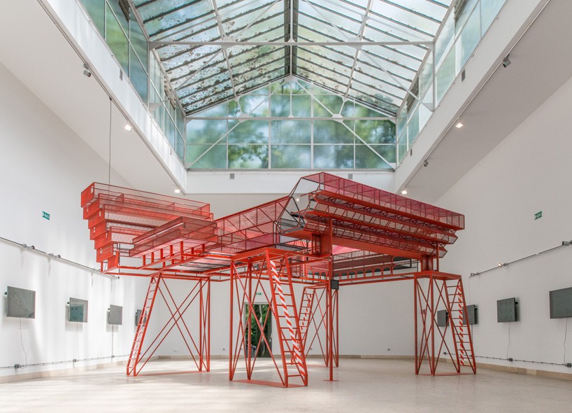 red scaffold-like structure set inside czech and slovak pavilion at venice biennale