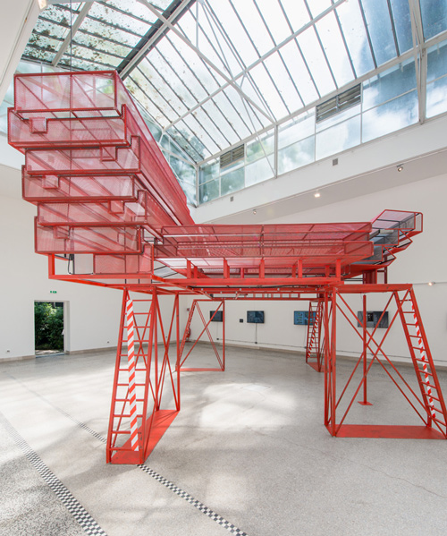 red scaffold-like structure set inside czech and slovak pavilion at venice biennale