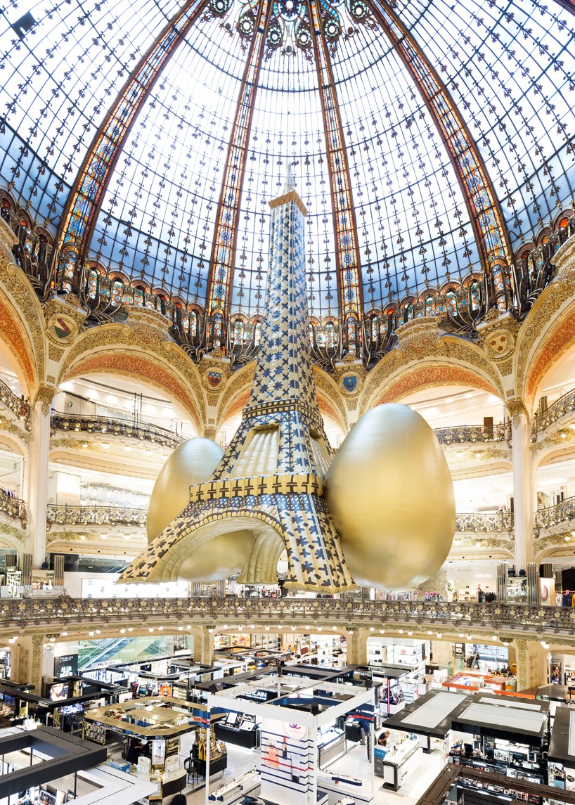TOILETPAPER with gufram + seletti install inflatable golden eiffel tower at galeries lafayette in paris