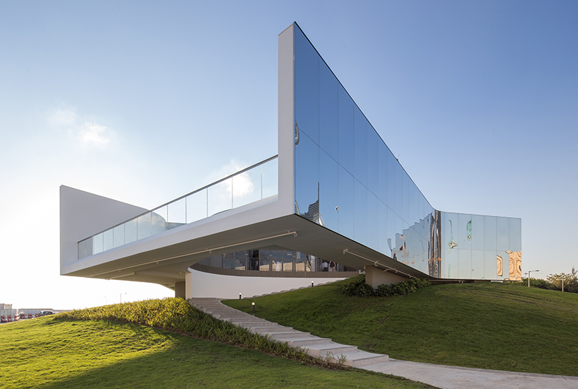 mirrored M+ pavilion completes in hong kong's west kowloon cultural district