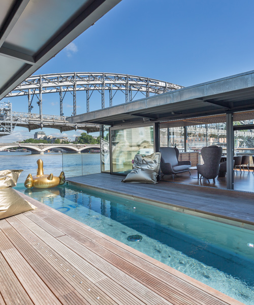 the floating OFF hotel docks by the riverbank of the seine in paris
