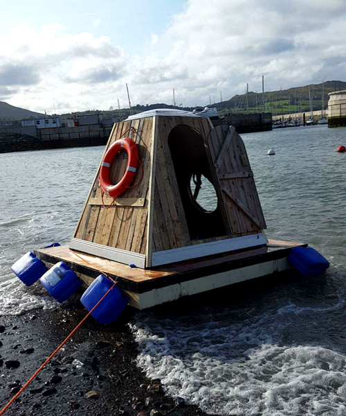 aodh design constructs small floating pod out of abadoned building materials