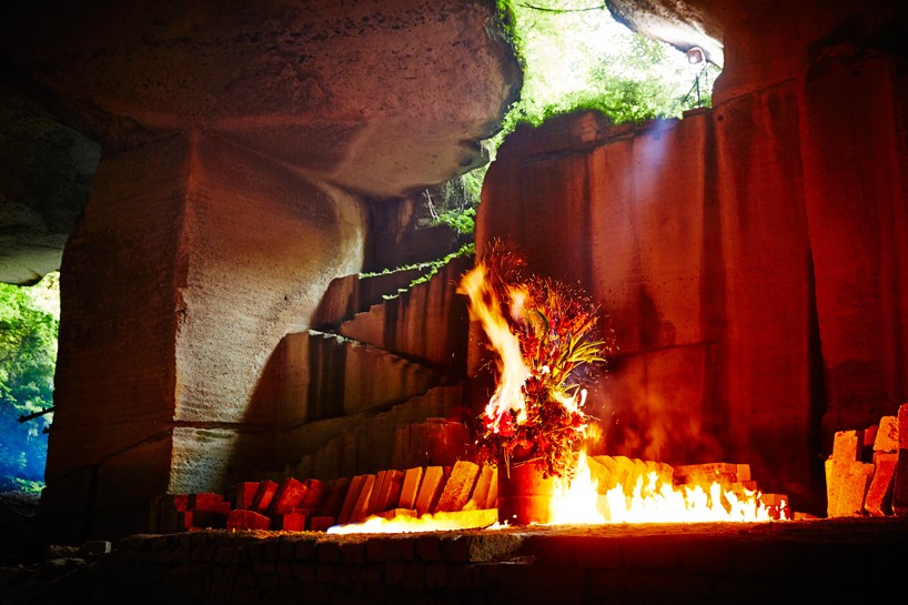azuma makoto's burning flowers installation reveals a dramatic performance