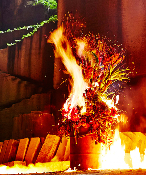 azuma makoto's burning flowers installation reveals a dramatic performance