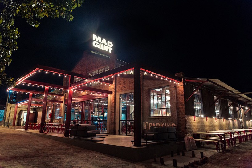 haldane martin transforms disused warehouse for mad giant beer brewery in johannesburg