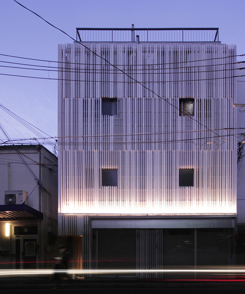 jun murata clads dwelling with a façade of vertical white fins in japan