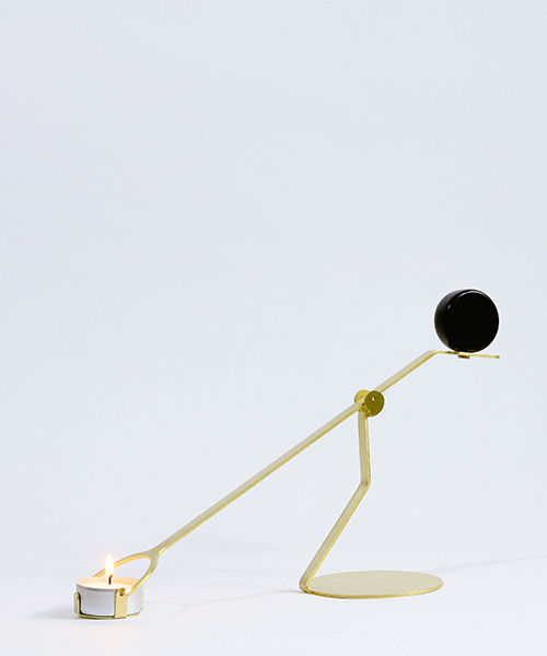 laura bin portrays dynamic between earth + fire in rising balance candleholder