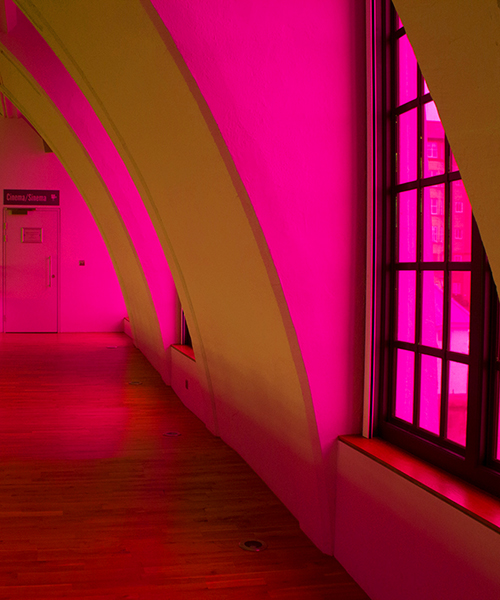 liz west bathes art deco building in yellow and hot pink hues