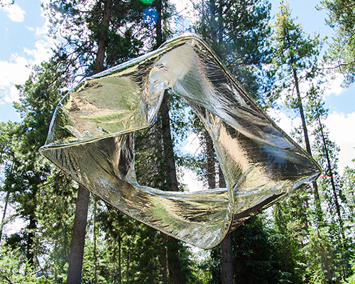 office ca suspends strip of NASA's MPET to reflect light into the dense colorado woods