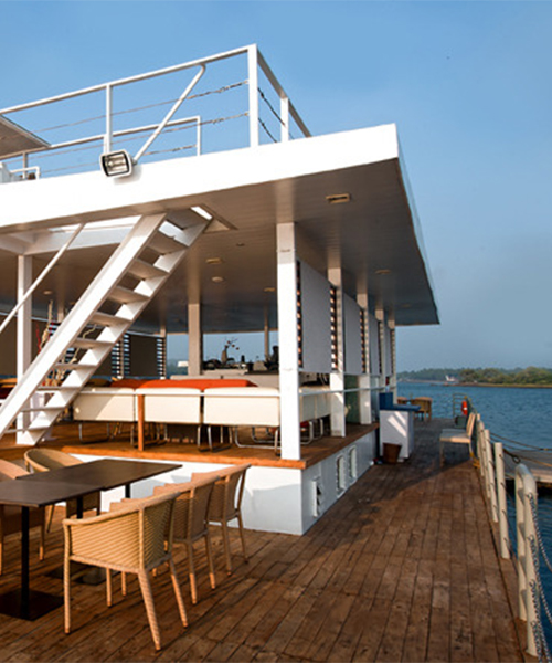 SDM architects restores a steel barge in india, into a floating restaurant