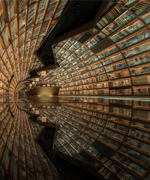 X+living uses black mirror glass to reflect books in chinese library