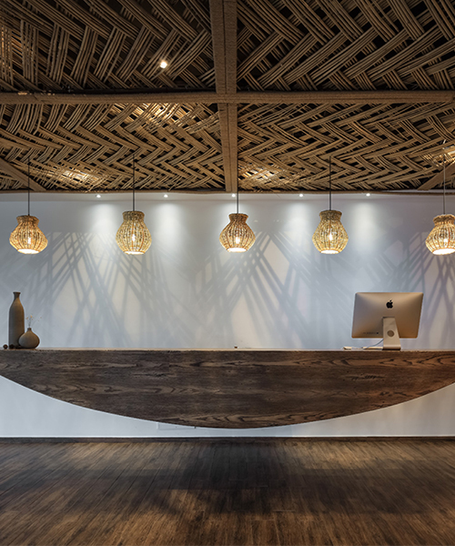 X+living adds bamboo weaved ceilings to ripple hotel in qiandao lake, china