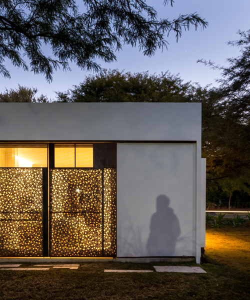 FCP arquitectura's mooe house in argentina contrasts white walls with perforated panels