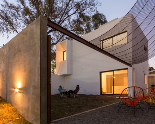 andrés alonso encloses three independent dwellings behind a concrete and corten wall