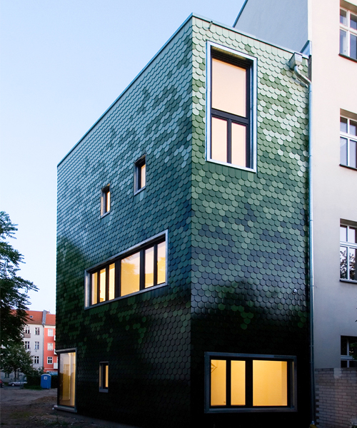 brandt + simon architekten adds green tile façade to berlin home
