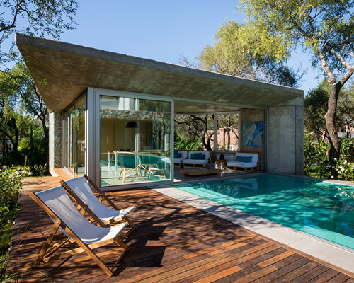 grupo urban's casa del bosque in argentina uses trees to provide privacy