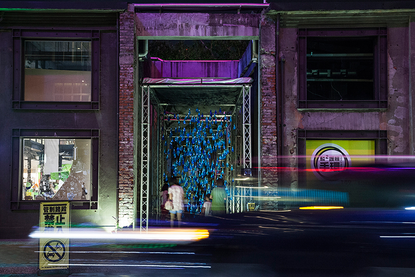 luzinterruptus forms interactive rain canopy in taiwan with 2,500 illuminated condoms